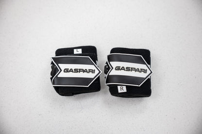 Gaspari Wrist Wraps labeled L and R for precise fit, offering support during heavy lifting.